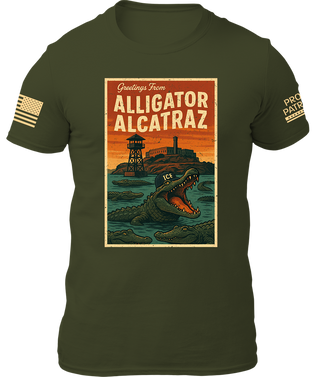 Alligator Alcatraz shirt in army green featuring a graphic of an alligator and a prison tower with sunset background.