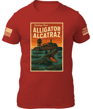 Alligator Alcatraz shirt in red featuring a graphic of an alligator and a prison tower with the text "Greetings From.