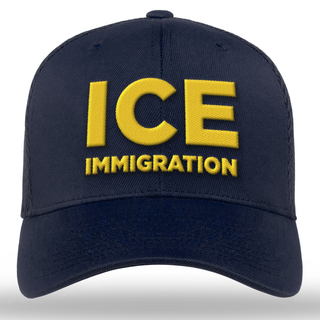 Navy blue embroidered hat featuring "ICE" in large yellow letters and "IMMIGRATION" below in smaller yellow text.