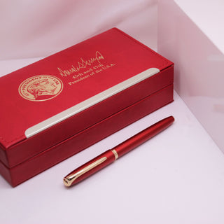 President Trump 2nd Term Executive Order pen in a red box with gold accents and signature detail.