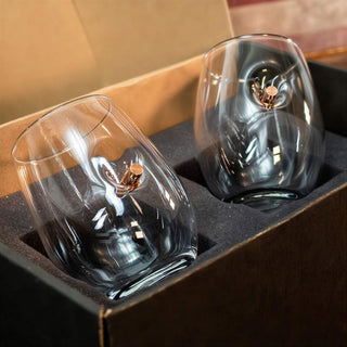 BenShot gift set featuring two clear whiskey glasses with a copper bullet embedded, presented in a black box.