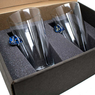 BenShot guitar pick glasses in a black gift box with foam padding, featuring blue guitar pick accents on each glass.