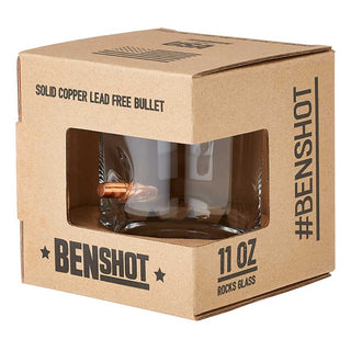 US flag rocks glass with a solid copper bullet design, displayed in a cardboard box with a clear window.