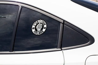 Black and white window decal on a sedan's back door displaying the text "F*ck Your Feelings" with a hand gesture.